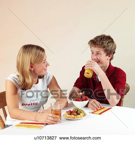 Stock Photo - Children eating and drinking. Fotosearch