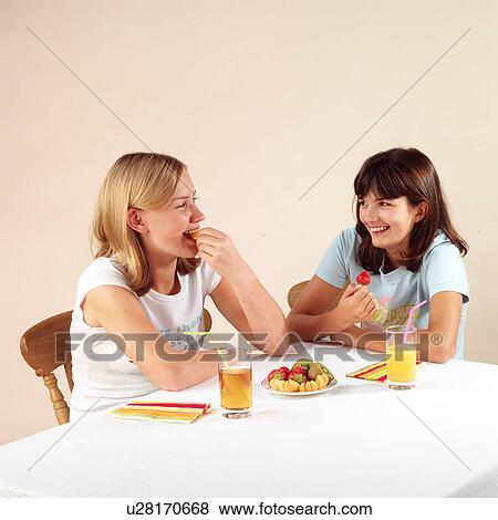 Stock Photo - Children eating and drinking. Fotosearch