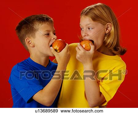 Children eating apples View Large Photo Image Stock Photo - Children eating apples. Fotosearch