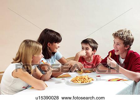Children eating View Large Photo Image Stock Photo - Children eating. Fotosearch