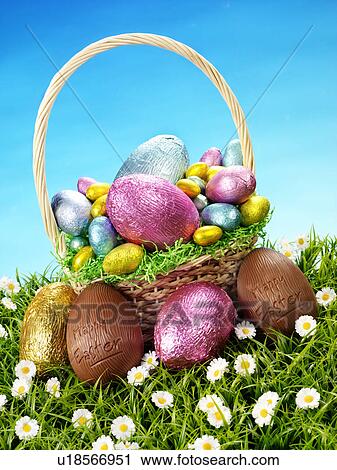Stock Image - Chocolate Eggs in Basket - Non Exclusive. Fotosearch