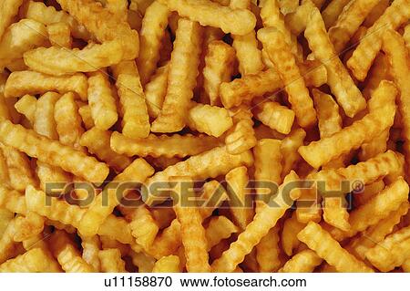 Stock Image - Crinkle cut chips, fries. Fotosearch