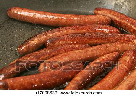 Frying sausages View Large Photo Image Stock Photo - Frying sausages. Fotosearch