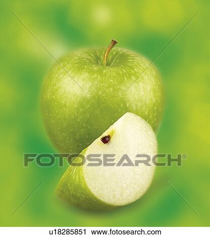 Stock Image - Green Apples On Green- Non Exclusive. Fotosearch