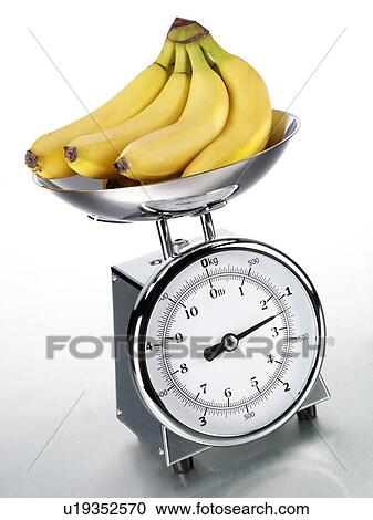 Stock Image - Kitchen Scales With Bananas - Non Exclusive. Fotosearch