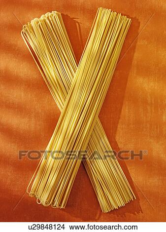 Long Spaghetti on Orange - Non Exclusive View Large Photo Image Picture - Long Spaghetti on Orange - Non Exclusive. Fotosearch