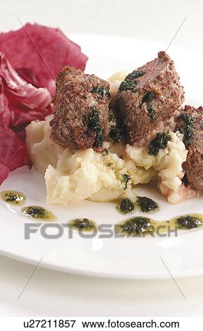 Stock Photo - Mustard crusted lamb. Fotosearch