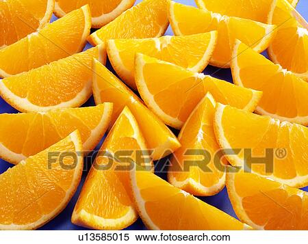 Orange Segments On Blue - Non Exclusive View Large Photo Image Stock Photography - Orange Segments On Blue - Non Exclusive. Fotosearch