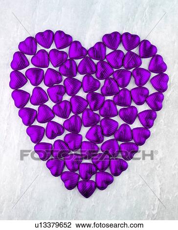 Stock Image - Purple Chocolate Heart on White - Non Exclusive. Fotosearch