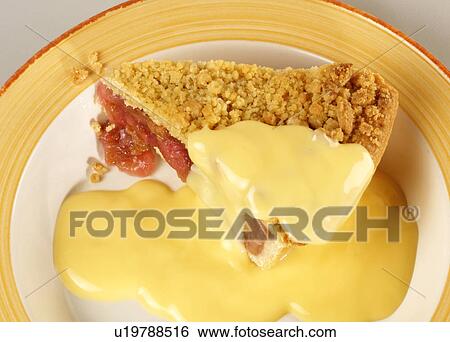 Stock Photograph - Rhubarb Crumble And Custard - Non Exclusive. Fotosearch