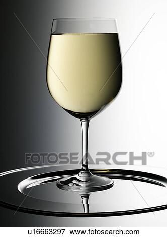 Stock Photo - Single Glass of White Wine - Non Exclusive. Fotosearch