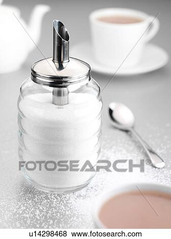 Stock Photo - Sugar shaker and tea. Fotosearch