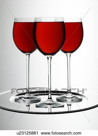 Stock Image - Three Glasses of Rose Blush Wine - Non Exclusive. Fotosearch