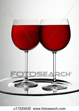 Stock Image - Two Glasses of Red Wine - Non Exclusive. Fotosearch