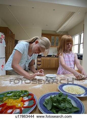 Picture - Young girls making pastry. Fotosearch