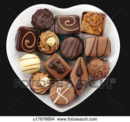 Belgian Chocolates in Heart Dish - Non Exclusive View Large Photo Image Picture - Belgian Chocolates in Heart Dish - Non Exclusive. Fotosearch