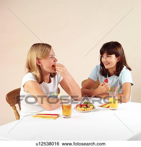 Children eating and drinking View Large Photo Image Stock Photograph - Children eating and drinking. Fotosearch