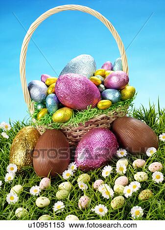 Stock Image - Chocolate Eggs in Basket - Non Exclusive. Fotosearch