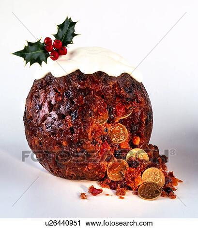 Stock Image - Christmas pudding with gold sovereigns. Fotosearch