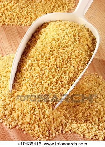 Couscous in Scoop - Non Exclusive View Large Photo Image Stock Photograph - Couscous in Scoop - Non Exclusive. Fotosearch