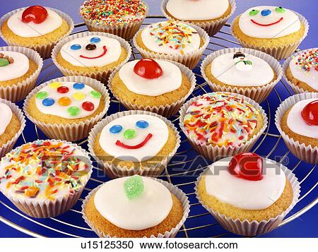 Stock Image - Cupcakes on Blue - Non Exclusive. Fotosearch