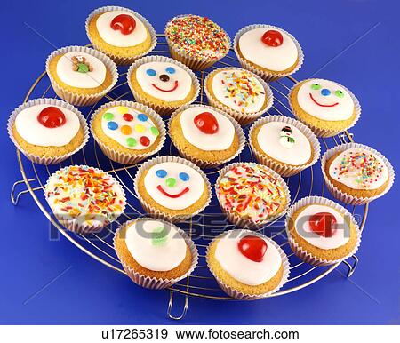Cupcakes on Blue - Non Exclusive View Large Photo Image Stock Photo - Cupcakes on Blue - Non Exclusive. Fotosearch