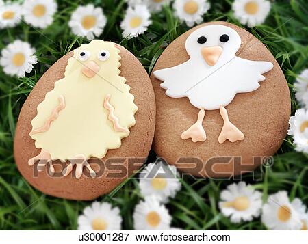 Stock Photo - Easter Cookies Biscuits on Grass - Non Exclusive. Fotosearch
