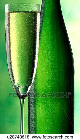 Stock Photo - green bottle and glass. Fotosearch