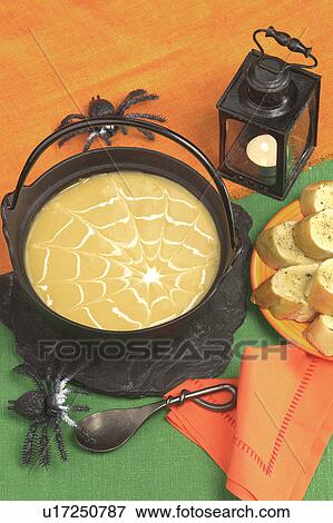 Stock Photo - Halloween soup with garlic bread. Fotosearch