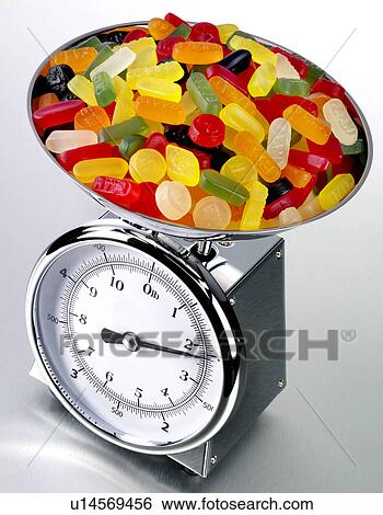 Stock Photograph - Kitchen Scales With Wine Gums - Non Exclusive. Fotosearch