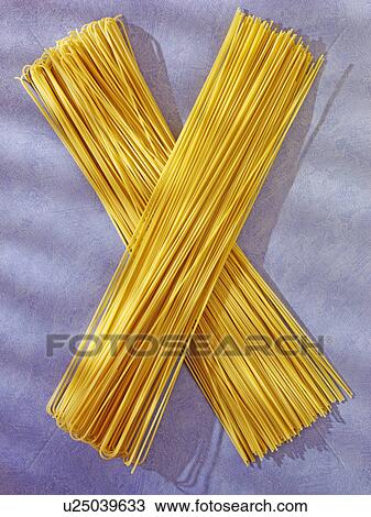 Stock Image - Long Spaghetti on Blue - Non Exclusive. Fotosearch