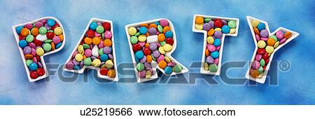 Stock Photograph - Party chocolate candies on Blue - Non Exclusive. Fotosearch