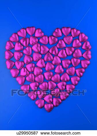 Pink Chocolate Heart on Blue - Non Exclusive View Large Photo Image Stock Photo - Pink Chocolate Heart on Blue - Non Exclusive. Fotosearch