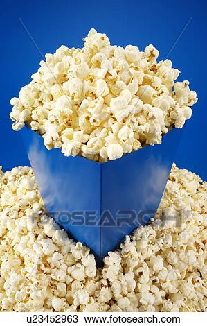 Stock Image - Popcorn on blue. Fotosearch