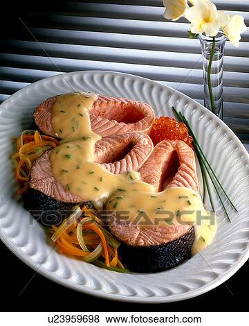 Stock Photo - Salmon steaks with sauce, . Fotosearch