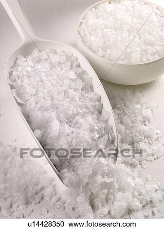 Stock Image - Sea Salt in Scoop - Non Exclusive. Fotosearch