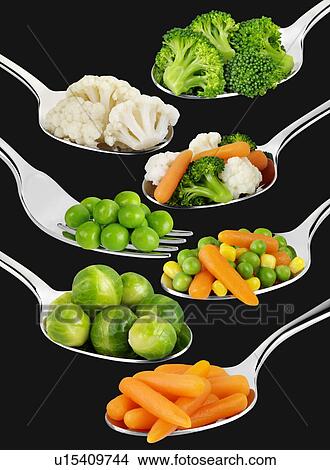 Picture - Spoons With Vegetables on Black - Non Exclusive. Fotosearch