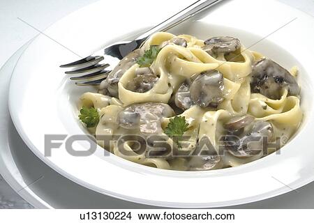Picture - Tagliatelle with mushrooms and cheese sauce, . Fotosearch