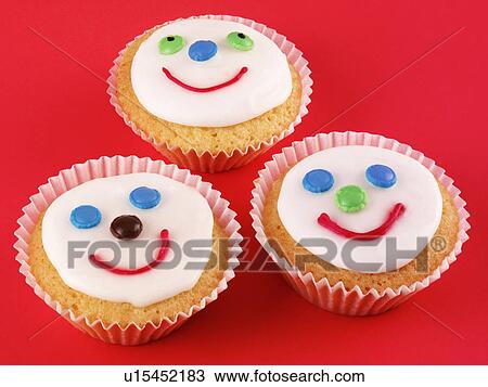Three Face Cupcake - Non Exclusive View Large Photo Image Stock Image - Three Face Cupcake - Non Exclusive. Fotosearch