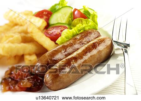 Stock Image - Two Sausages And Salad - Non Exclusive. Fotosearch