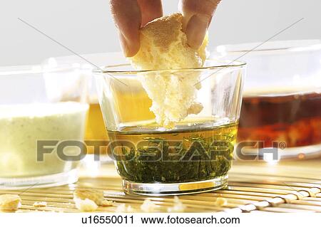 Stock Image - Olive Oil and Basil for Dipping. Fotosearch