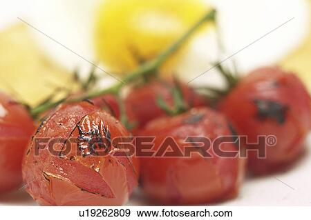 Roasted Cherry Tomatoes View Large Photo Image Stock Photo - Roasted Cherry Tomatoes. Fotosearch