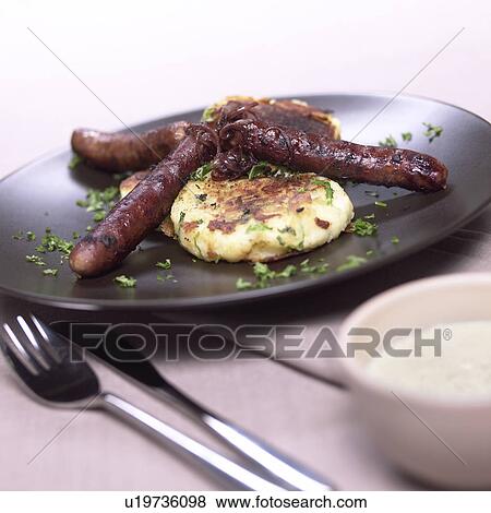 Sausages and fried potato View Large Photo Image Stock Photo - Sausages and fried potato. Fotosearch