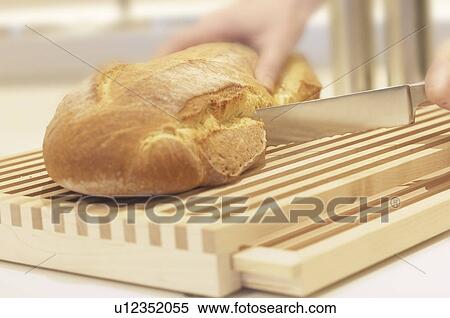 Stock Photography - Slicing Bread. Fotosearch