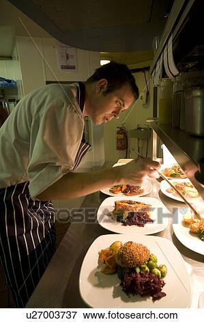 Stock Photo - Chef Preparing Food. Fotosearch
