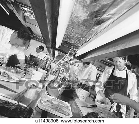 Chefs in restaurant kitchen View Large Photo Image Stock Photograph - Chefs in restaurant kitchen. Fotosearch