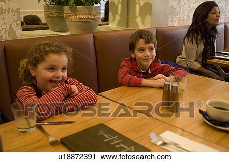 Stock Image - Children at a Restaurant. Fotosearch
