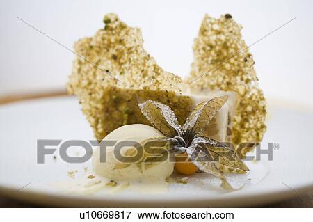Stock Photo - Ice Cream and Pistachio Biscuits. Fotosearch