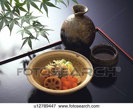 Stock Photo - Japanese Cooked Dish and Warmed Sake, High Angle View. Fotosearch