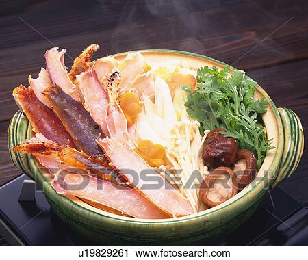 Stock Image - One Pot Dish Cooked at the Table, High Angle View. Fotosearch